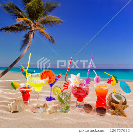 Colorful tropical cocktails at beach on white sand 126757623