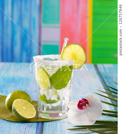 Cuban Mojito cocktail in tropical blue wood flowers and starfish Cuban Mojito cocktail in tropical blue wood flowers and starfish 126757646