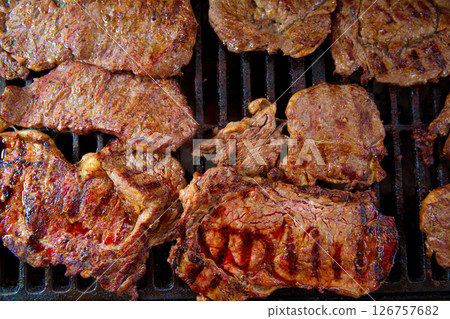 Beef meat barbecue grilled with embers and smoke Beef meat barbecue grilled with embers and smoke 126757682