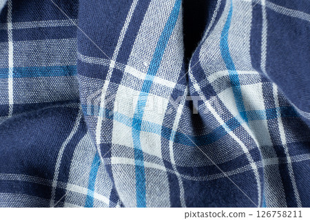 Macro texture of a fabric consisting of one hundred percent cotton. 126758211