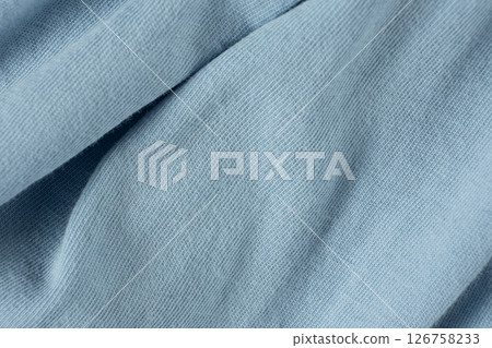 Macro texture of a fabric consisting of one hundred percent cotton. Macro texture of a fabric consisting of one hundred percent cotton. 126758233