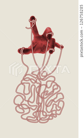 Puppet Mind. Red hand moves tangled brain by threads tied to fingers, symbolizing control, dependence and emotional manipulation. Conceptual art collage. 126758285