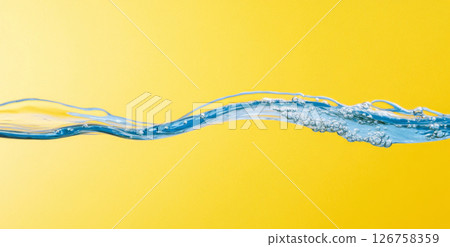 Close-up of blue water on yellow background with air bubbles 126758359