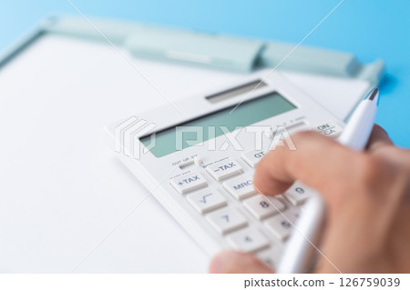 Binder and white calculator Binder and white calculator 126759039