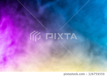 Blurred photo texture of colored smoke on a black background. 126759350