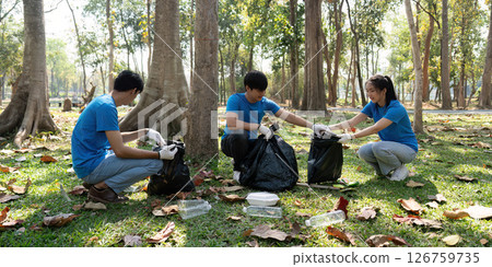 Collaboration and Environmental Responsibility. Volunteers sorting waste together, dedicated to keeping their community clean and green. Collaboration and Environmental Responsibility. Volunteers sorting waste together, dedicated to keeping their community clean and green. 126759735