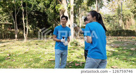 Sustainable volunteering. Volunteers celebrating teamwork during an eco project. Sustainable volunteering. Volunteers celebrating teamwork during an eco project. 126759746