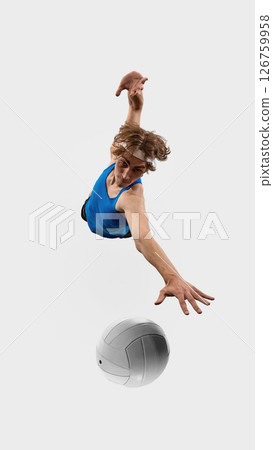 Aerial view photo. Dynamic shot of volleyball player lunges with one hand forward and feet off ground in athletic jump against white studio background Aerial view photo. Dynamic shot of volleyball player lunges with one hand forward and feet off ground in athletic jump against white studio background 126759958