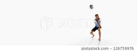 Banner. Volleyball player in ready stance with hands joined waits for the ball during match against white studio background with negative space 126759976