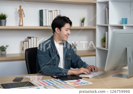 Modern Design: Young Professional Typing on Computer in Creative Workspace 126759998