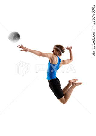 Side view of male athlete, dressed blue-black uniform in air targeting volleyball with sharp motion and focus against white studio background 126760002