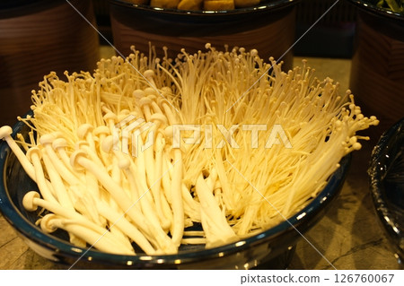 Fresh golden needle mushroom or enoki, enokitake (Flammulina velutipes) in wooden plate 126760067