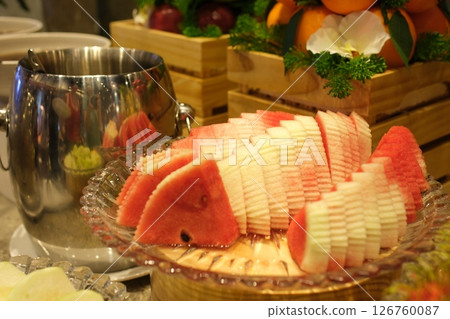 watermelon and watermelon slices on a half white background 126760087