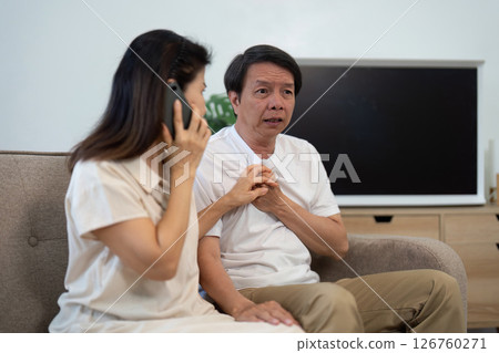 Wellness and Communication. Elderly couple discussing health issues at home. Wellness and Communication. Elderly couple discussing health issues at home. 126760271