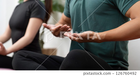 Wellness and Couple: Partners practicing mindfulness and meditation at home. 126760492