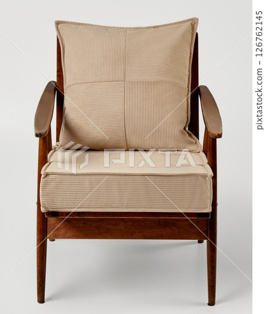 Modern armchair with beige cushion and pillow on white background Modern armchair with beige cushion and pillow on white background 126762145