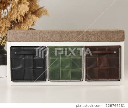 Modern entryway bench featuring stylish storage boxes with padded seat Modern entryway bench featuring stylish storage boxes with padded seat 126762281