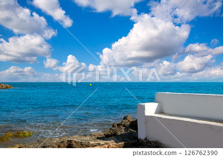 Torrevieja Alicante white bench in the shore rocks Torrevieja Alicante white bench in the shore rocks 126762390