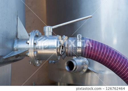 winemaking crushed grapes pumped into tank winemaking crushed grapes pumped into tank 126762464