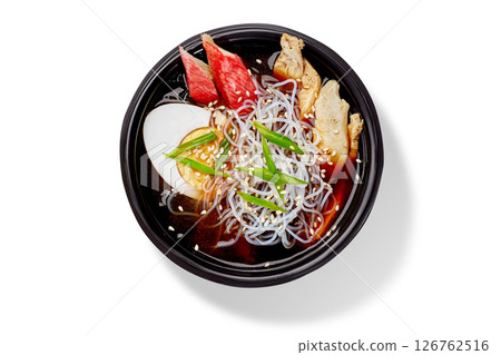 Steaming chicken and shirataki noodle soup with egg and sesame seeds 126762516