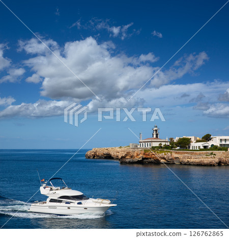 Ciutadella Sa Farola Lighthouse with yatch boat 126762865
