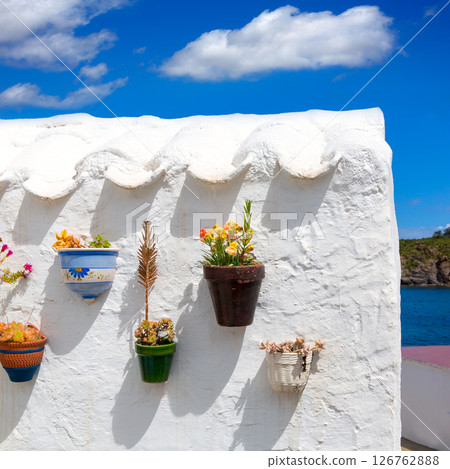 Menorca Es Grau white house flower pots detail in Balearic Menorca Es Grau white house flower pots detail in Balearic 126762888