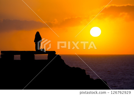 Ciutadella Menorca at Punta Nati sunset with girl Ciutadella Menorca at Punta Nati sunset with girl 126762929