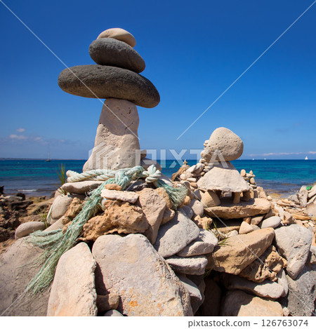 Stone figures on beach shore of Illetes beach in Formentera 126763074