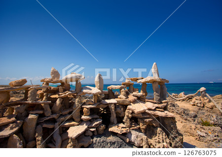 Stone figures on beach shore of Illetes beach in Formentera 126763075