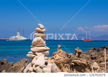 Stone figures on beach shore of Illetes beach in Formentera Stone figures on beach shore of Illetes beach in Formentera 126763079