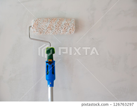 Paint roller for painting wall after plastering 126763297