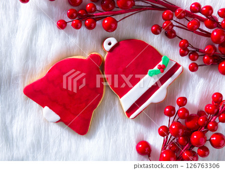Christmas cookies red bell shape on white fur 126763306
