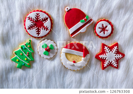 Christmas cookies Xmas tree Santa snowflake on white fur 126763308