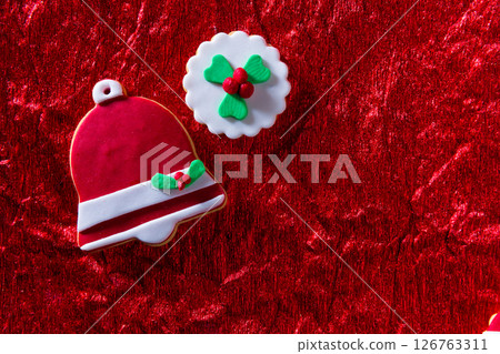 Christmas cookies Xmas bell on red background Christmas cookies Xmas bell on red background 126763311