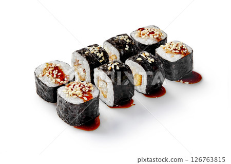 Delicious sushi rolls with eel and sesame seeds drizzled with unagi sauce on white background 126763815
