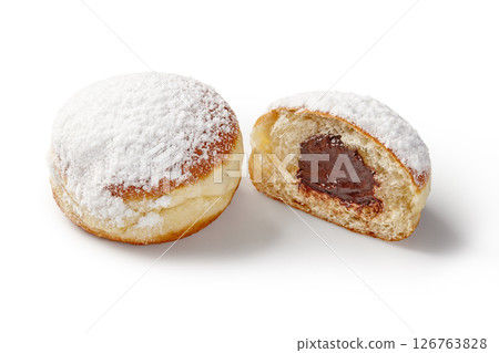 Delicious bomboloni doughnuts with chocolate filling and powdered sugar topping 126763828