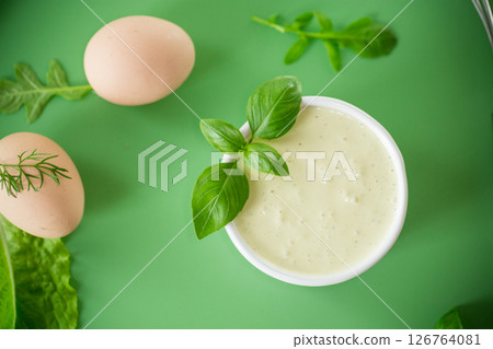 Top view of homemade mayonnaise with green herbs and eggs Top view of homemade mayonnaise with green herbs and eggs 126764081