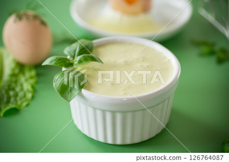 Top view of homemade mayonnaise with green herbs and eggs 126764087
