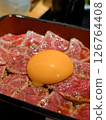 Marbled Wagyu beef tataki rice bowl topped with egg yolk 126764408