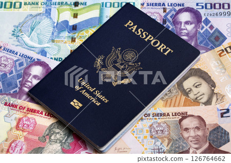 American passport on a Sierra Leonean money 126764662