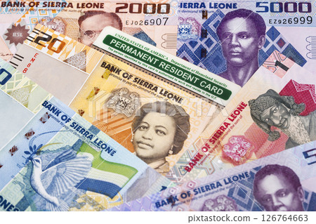 American Permanent Resident Card on a Sierra Leonean money 126764663