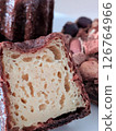 Cross section and outer texture of a freshly baked canelé 126764966