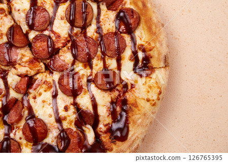 An appetizing sausage pizza, freshly made from the oven 126765395