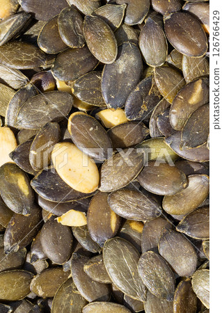 Raw Pumpkin Seeds Pile Macro View 126766429