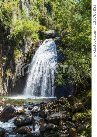 Vertical photography featuring Waterfall Korbu on a summer day. Altai 126766852