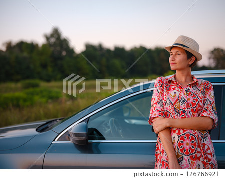 Traveler woman drives car through scenic countryside of Croatia 126766921