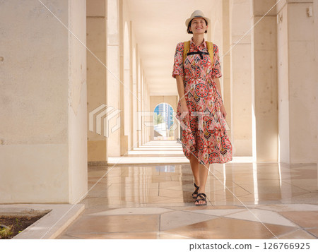 Young female tourist exploring iconic landmarks of the United Arab Emirates. 126766925