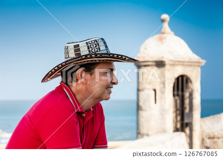 Male tourist wearing a sombrero vueltiao in Cartagena. Colombian people. Travel concept. Male tourist wearing a sombrero vueltiao in Cartagena. Colombian people. Travel concept. 126767085
