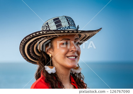 Beautiful young woman tourist wearing a sombrero vueltiao in Cartagena. Colombian people. Travel concept. 126767090
