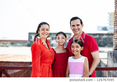Young family of four traveling together. Family love concept. Travel concept. Cartagena de Indias. 126767095